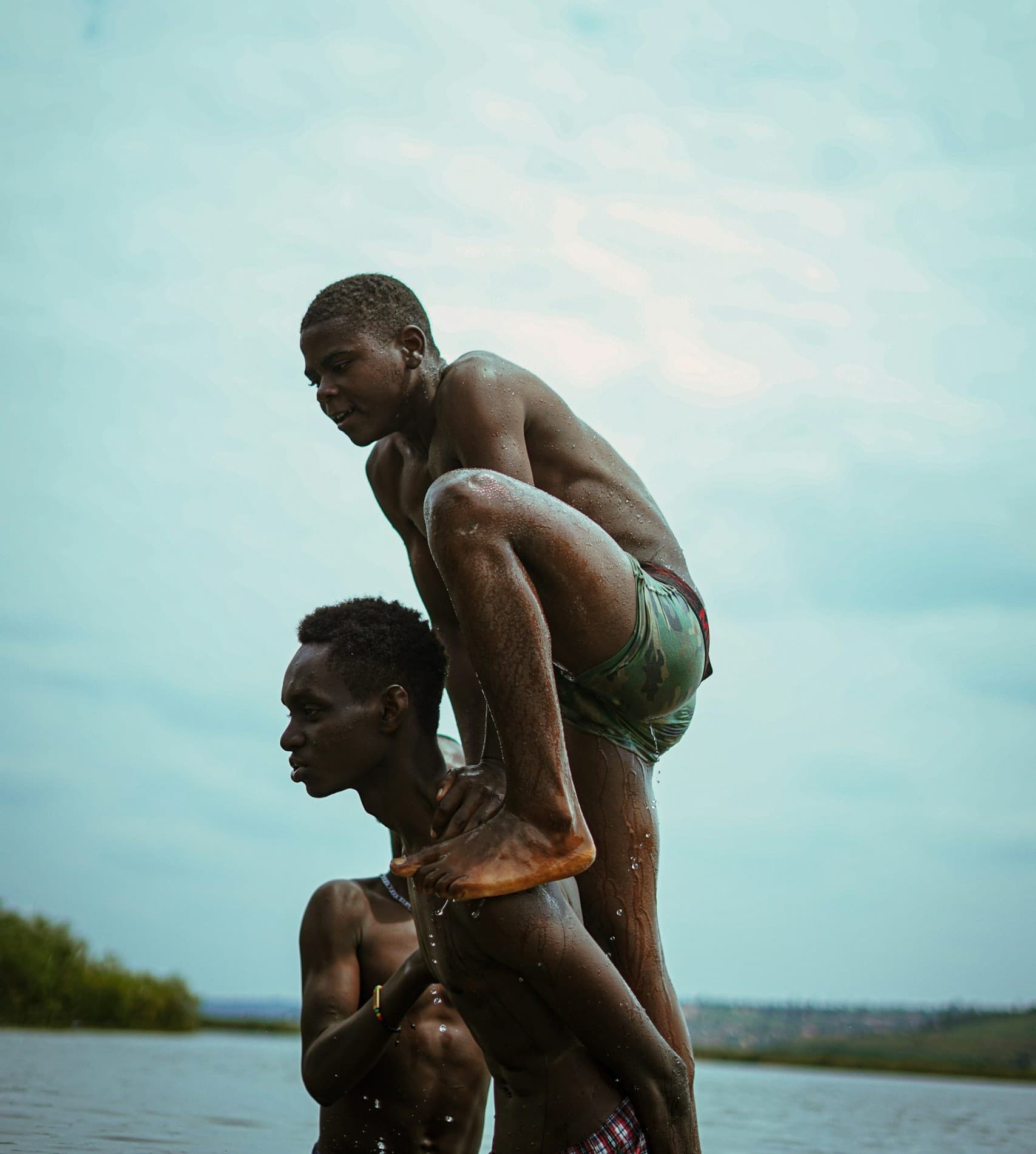 Two young men bathing in a river